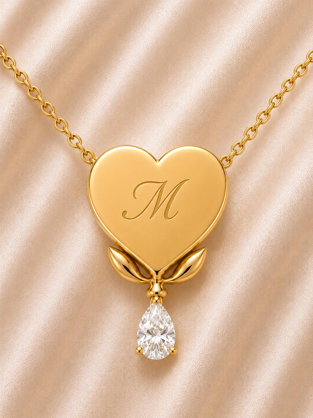 The Bleeding Heart Engravable Necklace in gold with engraved initial and pearl drop